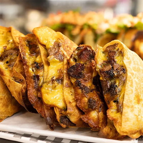Crispy stuffed cheesesteak tacos with melted cheese at Schmidt's Country Market in Quogue, NY